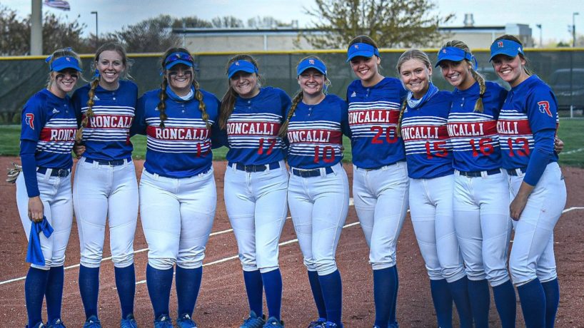 The Roncalli Softball team poses on the field