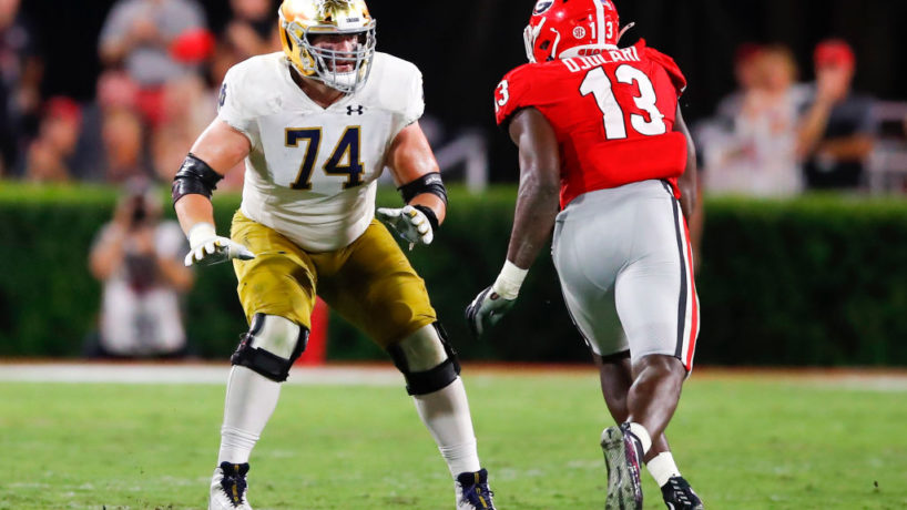 Former Notre Dame left tackle Liam Eichenberg sets up with a Georgia defensive lineman running towards him
