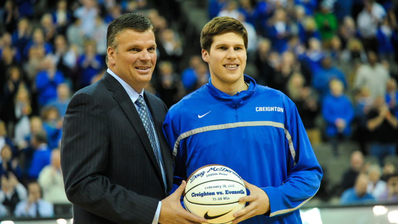 Doug McDermott #3 accepts a ball from his father head coach Greg McDermott of the Creighton Bluejays before the game against the Southern Illinois Salukis at the CenturyLink Center on February 19, 2013 in Omaha, Nebraska.