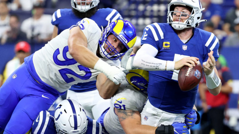 Colts QB-Carson Wentz tries to avoid a sack.