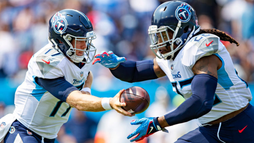 NASHVILLE, TENNESSEE - SEPTEMBER 12: Ryan Tannehill #17 makes a hand off to Derrick Henry #22 of the Tennessee Titans during the game against the Arizona Cardinals at Nissan Stadium on September 12, 2021 in Nashville, Tennessee. The Cardinals defeated the Titans 38-13. (Photo by Wesley Hitt/Getty Images)