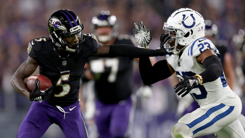 Marquise Brown stiff arming Kenny Moore