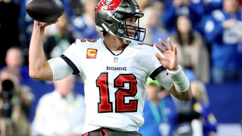 Tom Brady drops back to pass and motions to throw against the Colts at Lucas Oil Stadium