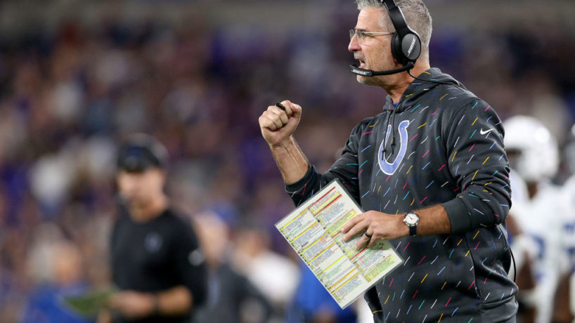 Colts HC-Frank Reich pumps his fist during a game.