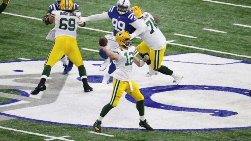 Aaron Rodgers throws a pass for the Packers against the Colts with his offensive line blocking for him