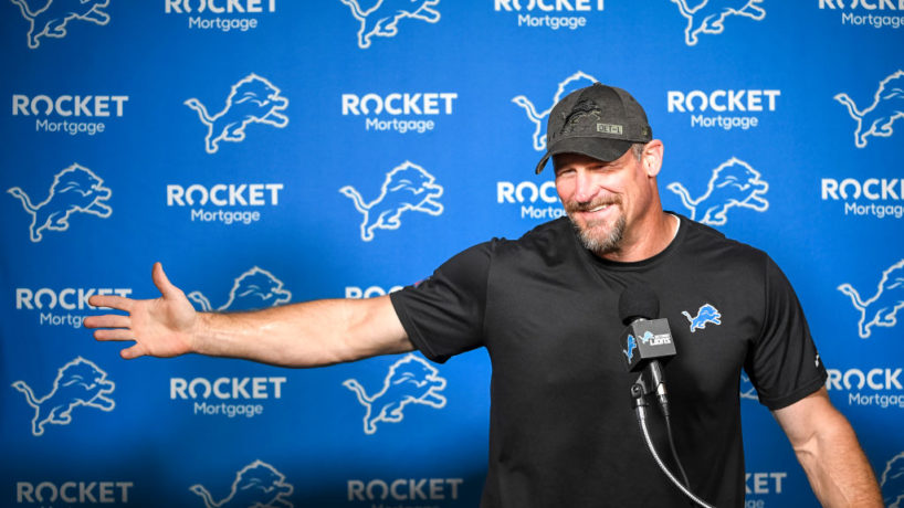 Dan Campbell reacts in a press conference.