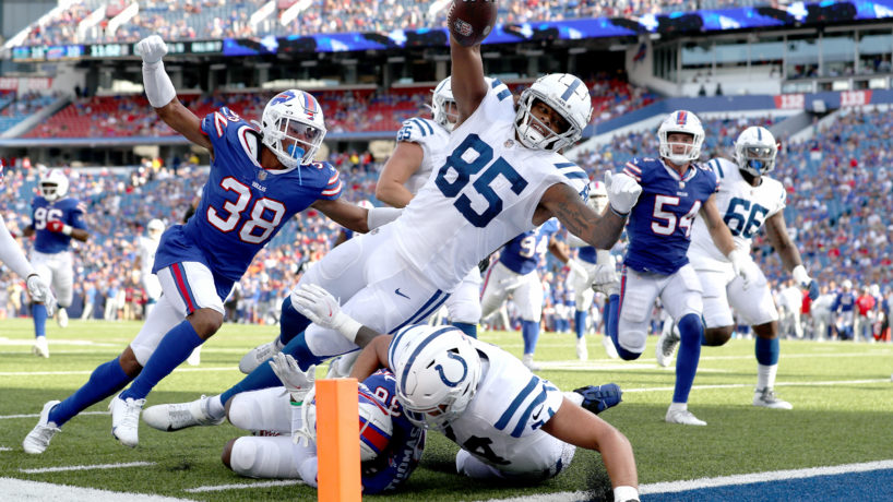 Andrew Ogletree leaping for endzone with ball