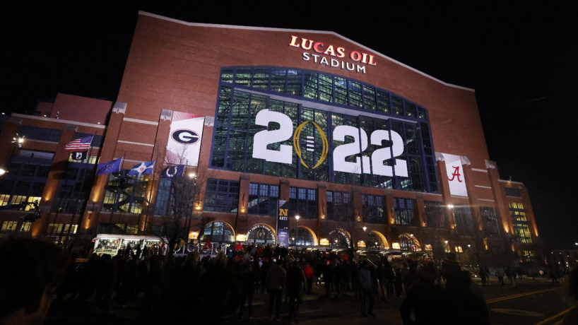 Exterior picture of Lucas Oil Stadium with CFP decor on building