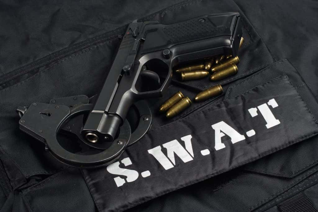 SWAT Vest, with handcuffs, pistol and bullets