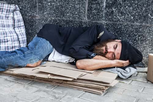 Homeless man sleeping on street
