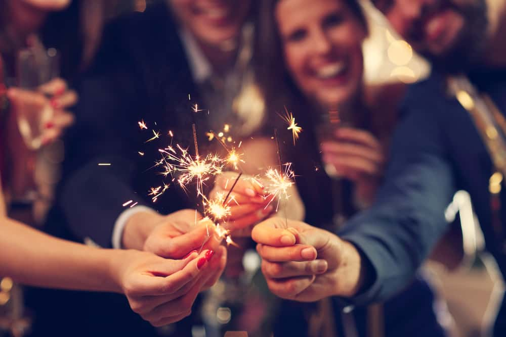 A group of people with sparklers