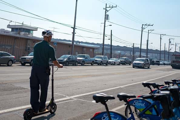 Commuting On Scooter:Getty Images