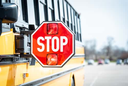 Yellow School Bus with Red Stop Sign