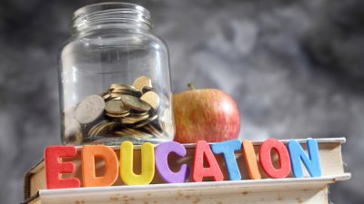 School funding jar full of coins
