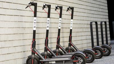 A row of dockless scooters