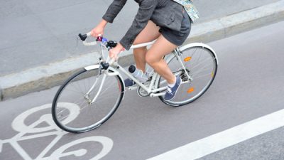 Woman traveling on a bicycle