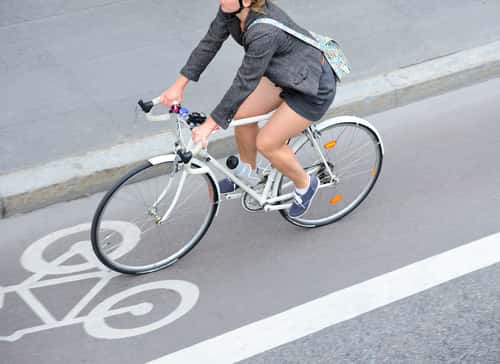 Woman traveling on a bicycle