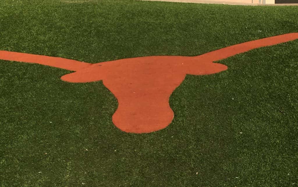 Longhorn logo on grass at DKR Memorial Stadium in Austin, TX