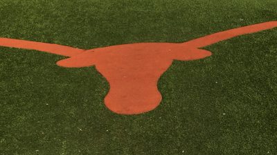 Longhorn logo on grass at DKR Memorial Stadium in Austin, TX