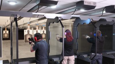 People shooting in a gun range
