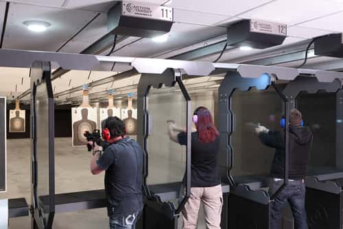 People shooting in a gun range