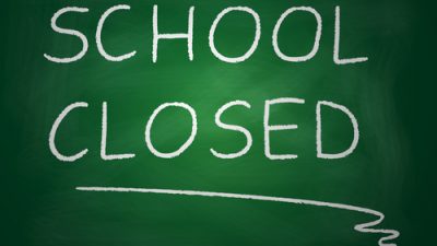 Chalk board with the words written: "School Closed"