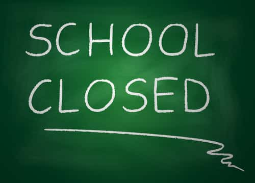 Chalk board with the words written: "School Closed"