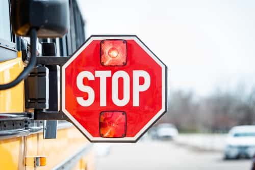 School bus with stop sign arm facing outward