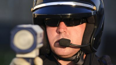 Cop pointing radar gun