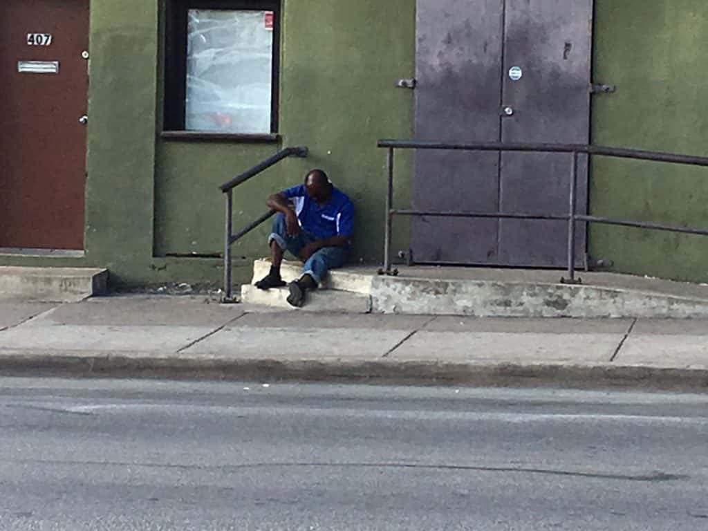 Homeless man downtown near the ARCH