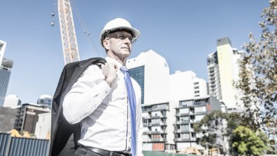 Man in suit and hard hat