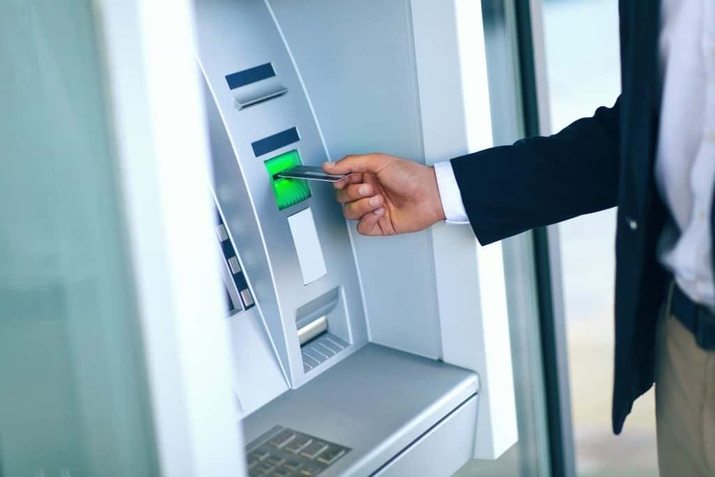 man at an ATM machine