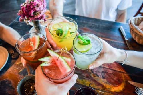 People toasting with drinks