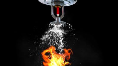 Fire sprinkler system putting out fire