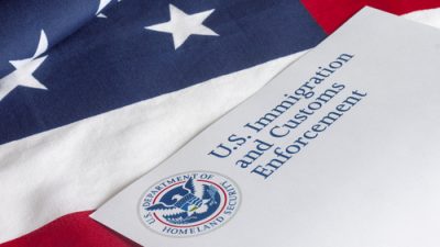 ICE binder on US flag