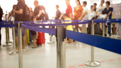 Passengers online at airport security checkpoint