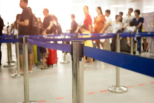 Passengers online at airport security checkpoint