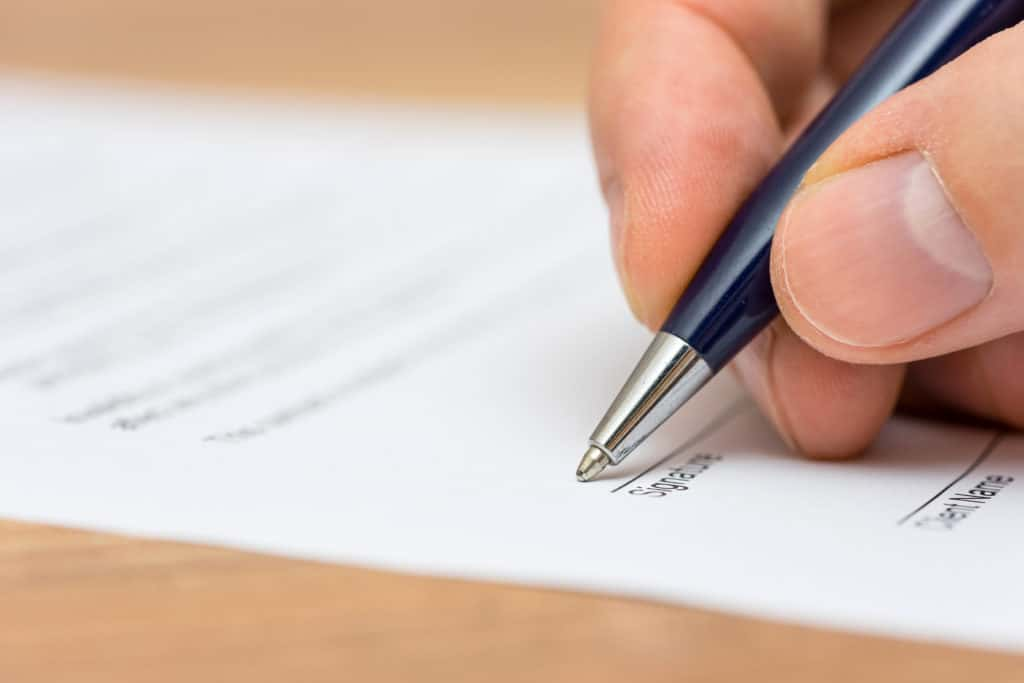 hand signing a document