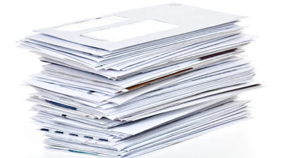 big-stack-of-unpaid-bills-and-envelopes