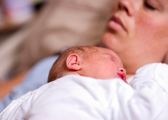 sleeping-newborn-baby-exhausted-mother