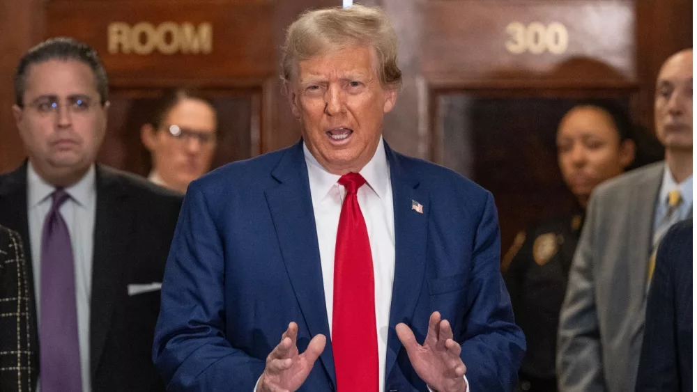 Former President Donald Trump speaks to the press before closing arguments at his civil fraud trial at State Supreme Court in New York on January 11^ 2024