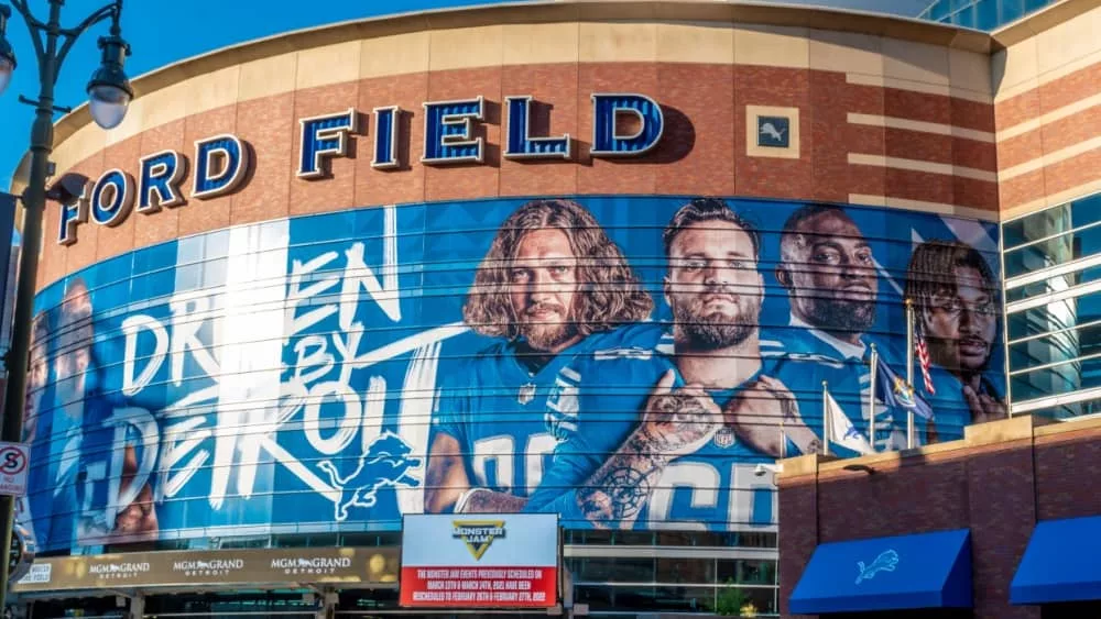 Horizontal^ medium closeup of "Ford Field" Detroit Lions' football field stadium's exterior facade brand and logo signage on a sunny day. Detroit^ MI USA - September 15^ 2021