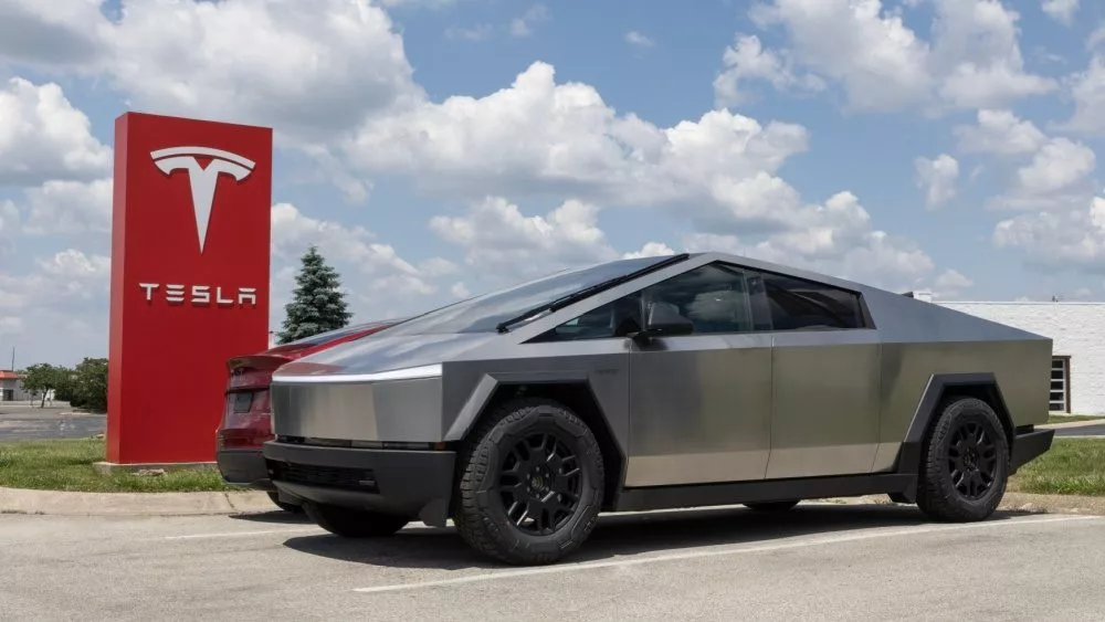 Tesla Cybertruck display at a dealership. Tesla claims the Cybertruck has a driving range of up to 340 miles. Indianapolis - May 19^ 2024: