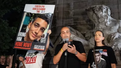 Adi Alexander speaks with Yael at his side^ parents of Edan Alexander at rally and memorial service for 6 hostages who were kidnapped and murdered by Hamas on Columbus Circle in New York on Sep 1 2024