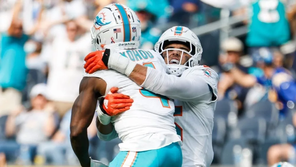 Miami Dolphins cornerbacks Kader Kohou (4) celebrates with Jalen Ramsey (5) after an interception against the Los Angeles Chargers during an NFL football game^ Sept. 10^ 2023^ in Inglewood^ Calif.