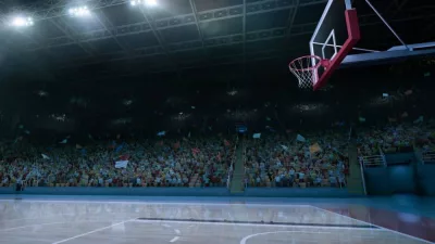 empty basketball court; shot of hoop and crowd in background