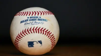 Major League Baseball (MLB) Baseball on black background