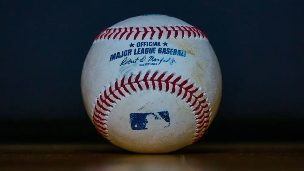 Baseball with 'Official Major League Baseball' Inscription and Blue MLB Batter Silhouette Logo