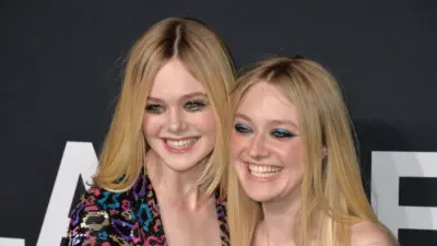 Elle Fanning & Dakota Fanning arriving at the Saint Laurent at the Palladium fashion show at the Hollywood Palladium. LOS ANGELES^ CA - FEBRUARY 10^ 2016