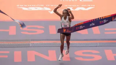 Hellen Obiri of Kenya crossing finish line with time 2:27:23 as a winner of TCS New York City marathon in open women's division in Central Park in New York on November 5^ 2023